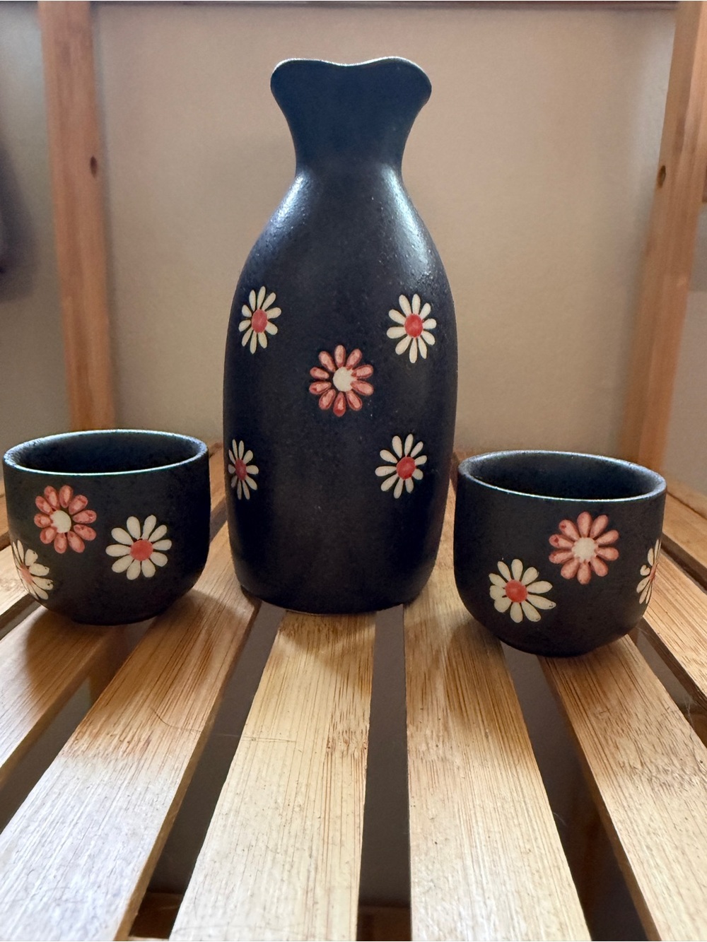Black Ceramic Floral Sake Set with Pink and White Daisy Accents